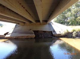 Damage to riprap abutment of FM 937 bridge over Montgomery Creek.