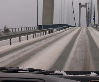 snow on bridge pavement